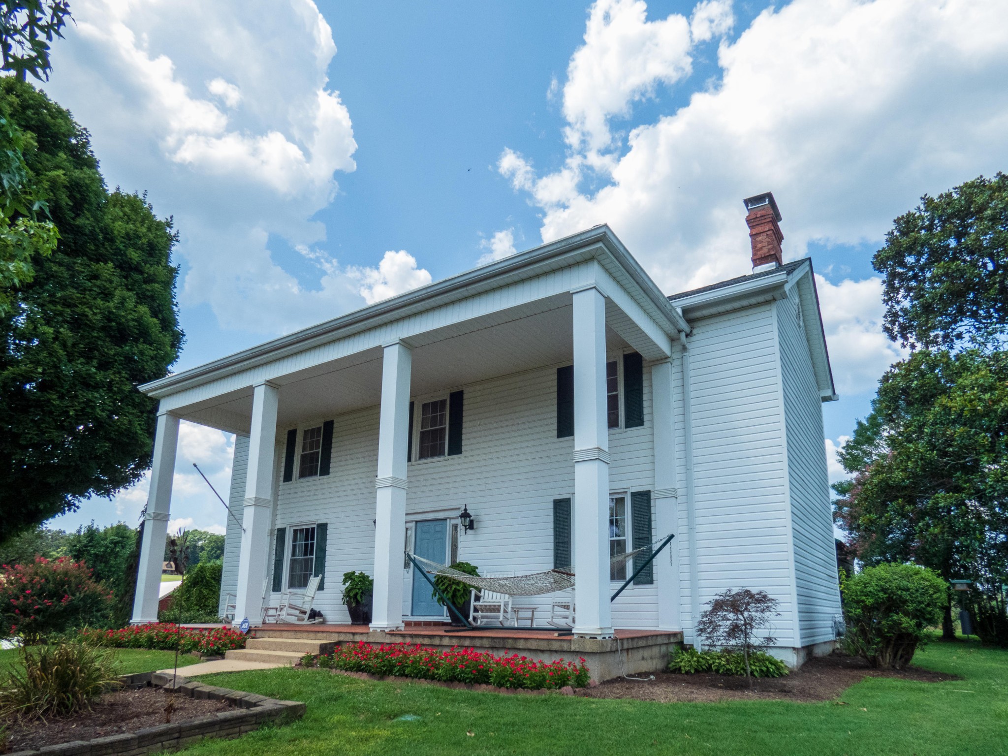 4965 Roberson Spring Road Loudon, TN 37774 - Photo 5 of 39 a front view of a house with a garden and plants