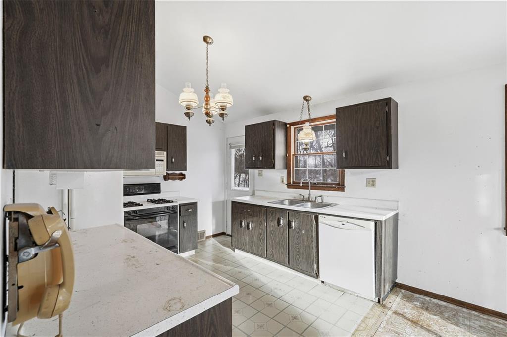 120 Grandview Drive Freeport, PA 16229 - Photo 20 of 40 a kitchen with kitchen island granite countertop a sink stove and microwave