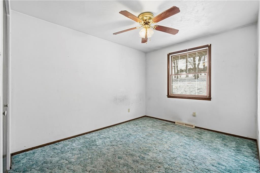 120 Grandview Drive Freeport, PA 16229 - Photo 30 of 40 an empty room with a window and a ceiling fan