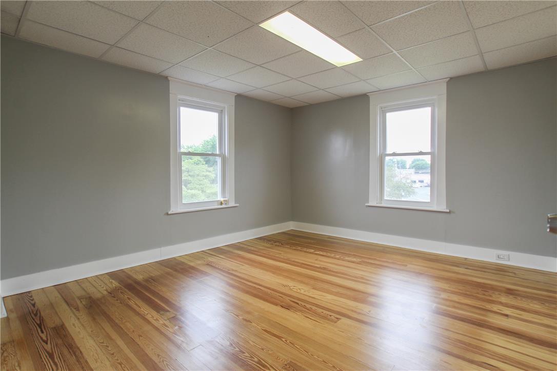 933 Philadelphia Road Easton, PA 18042 - Photo 13 of 23 Polished hardwood floors and classic window frames define this versatile room.
