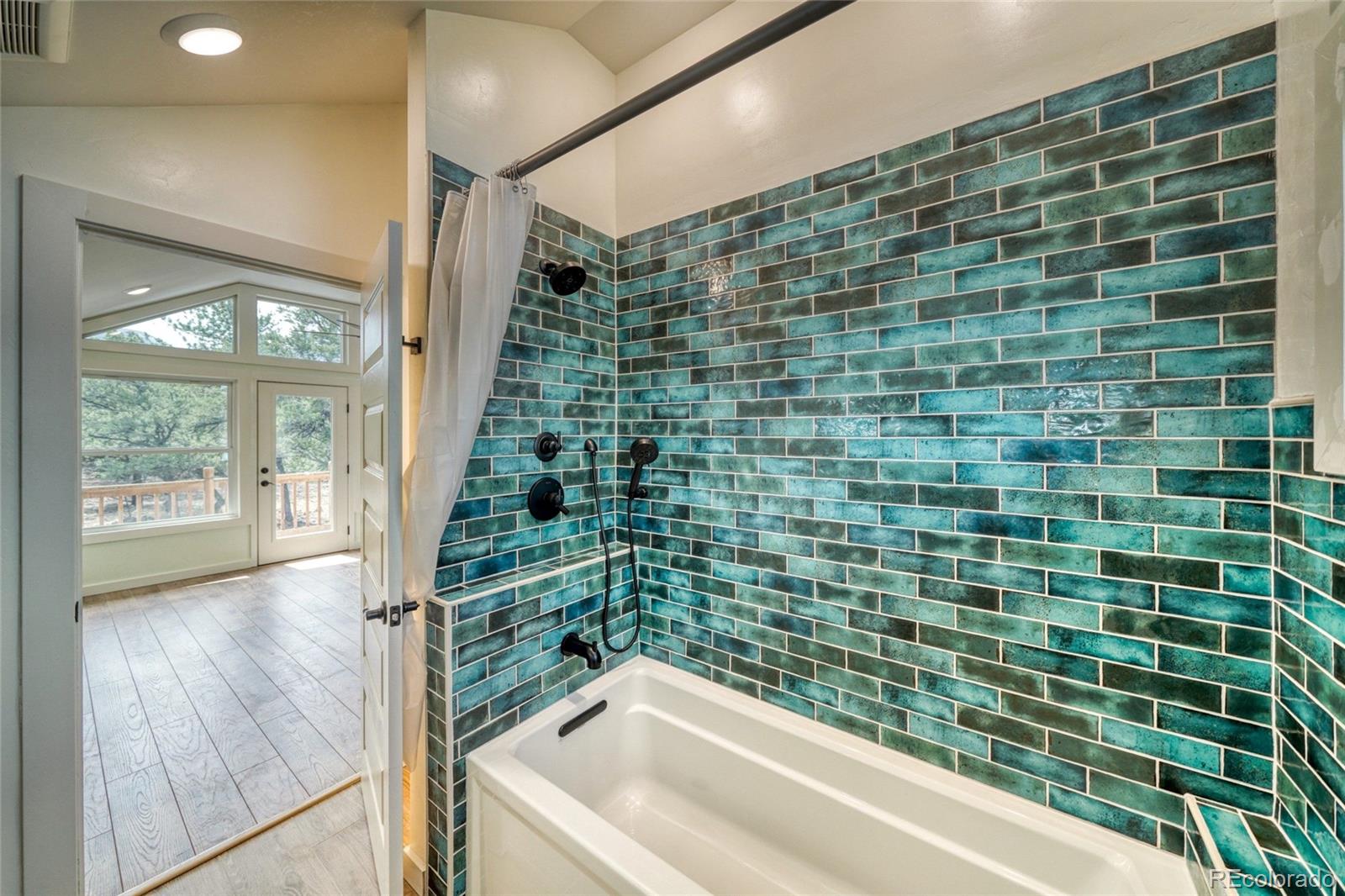 15351 Chimney Rock Road Nathrop, CO 81236 - Photo 15 of 48 a bathroom with a shower and a bathtub