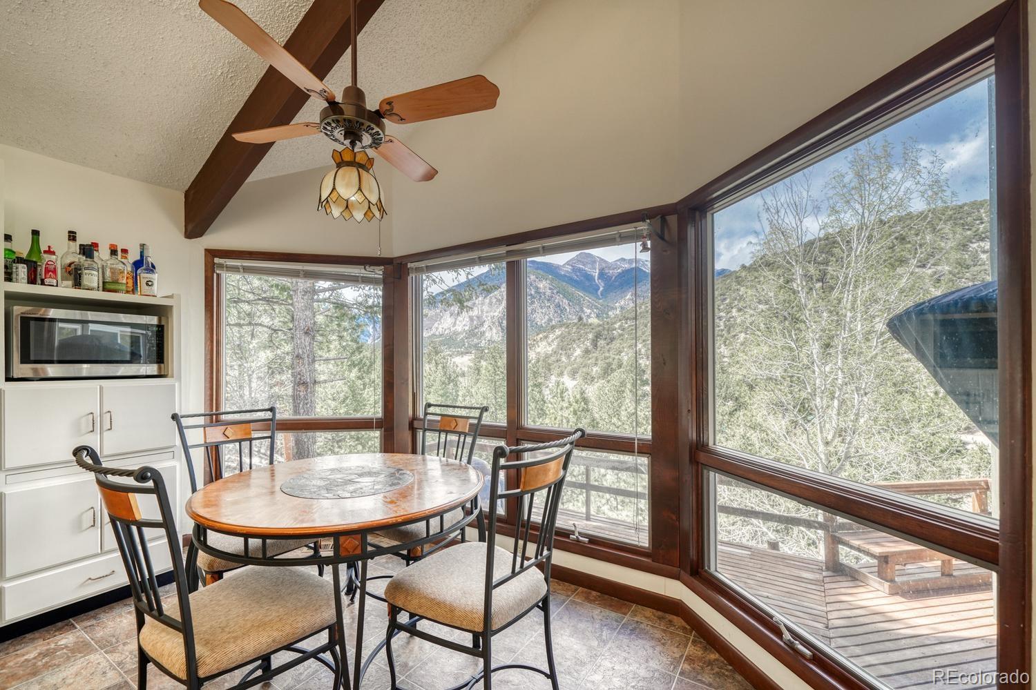 15351 Chimney Rock Road Nathrop, CO 81236 - Photo 27 of 48 a view of a dining room with furniture window and outside view