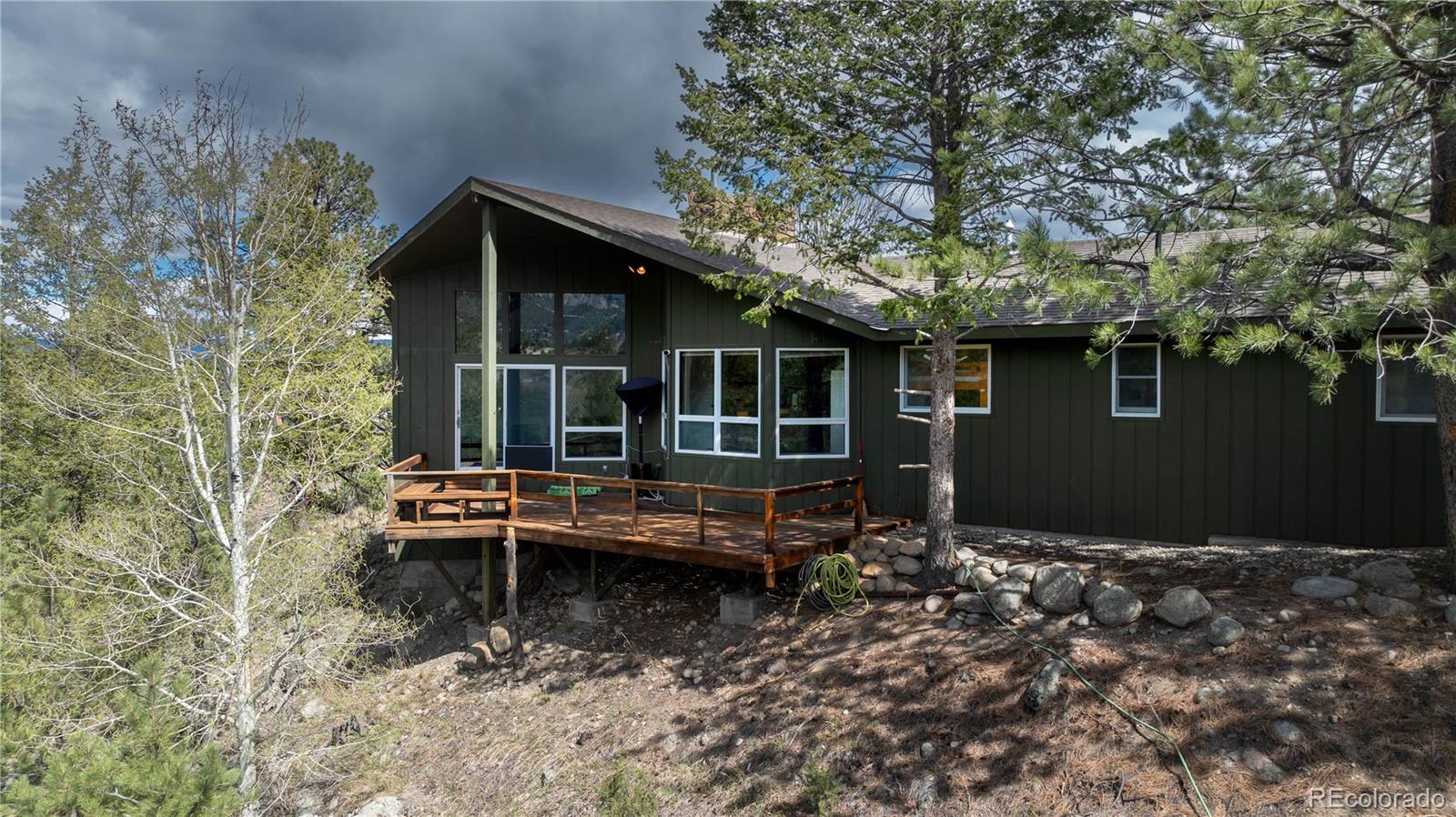 15351 Chimney Rock Road Nathrop, CO 81236 - Photo 39 of 48 a backyard of a house with outdoor seating