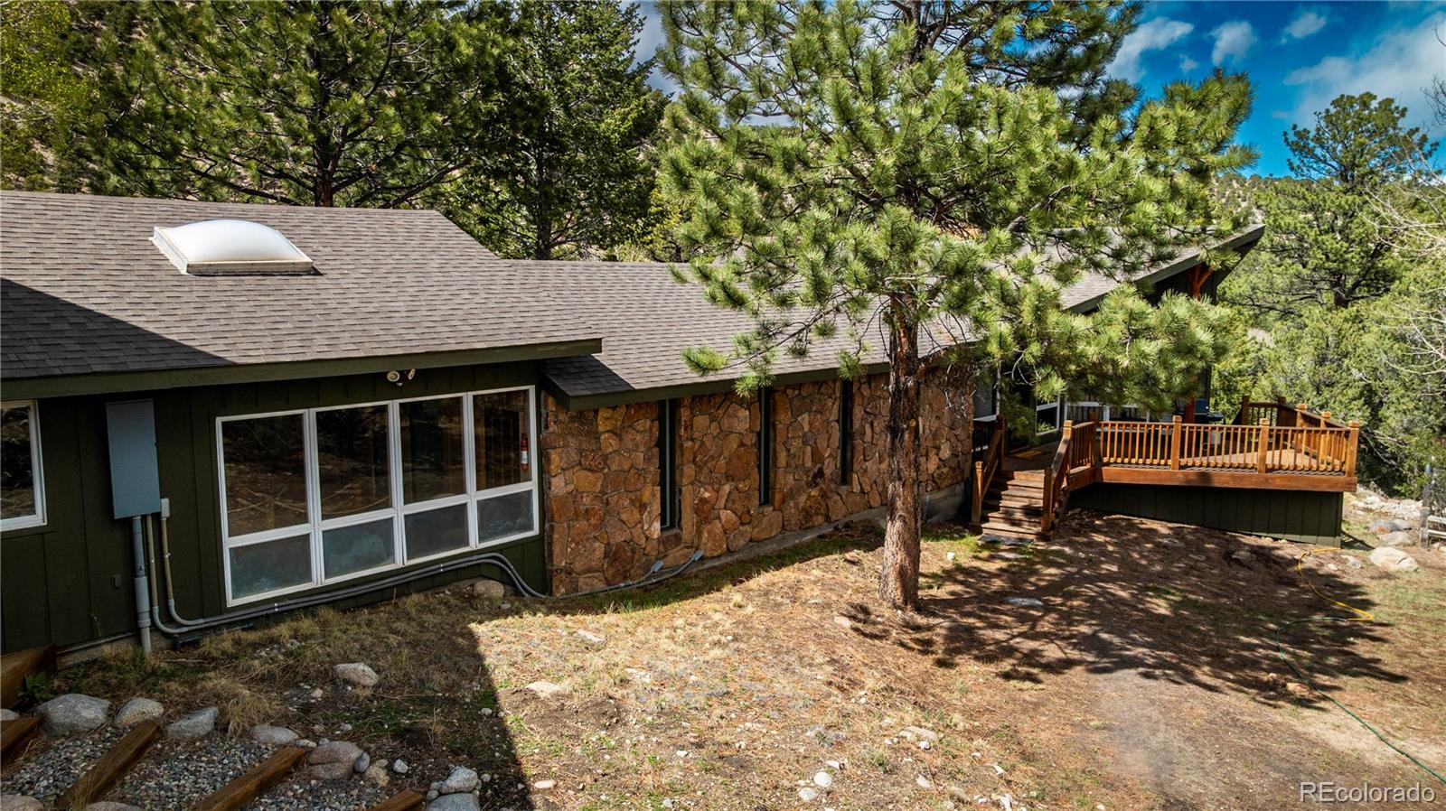 15351 Chimney Rock Road Nathrop, CO 81236 - Photo 47 of 48 a backyard of a house with table and chairs