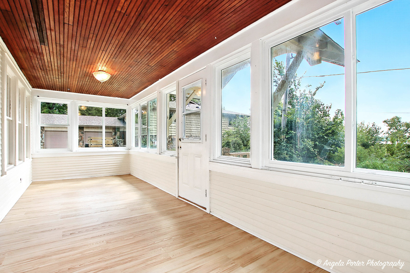 41028 North Ridge Circle Antioch, IL 60002 - Photo 14 of 29 a view of an empty room with a window and wooden floor