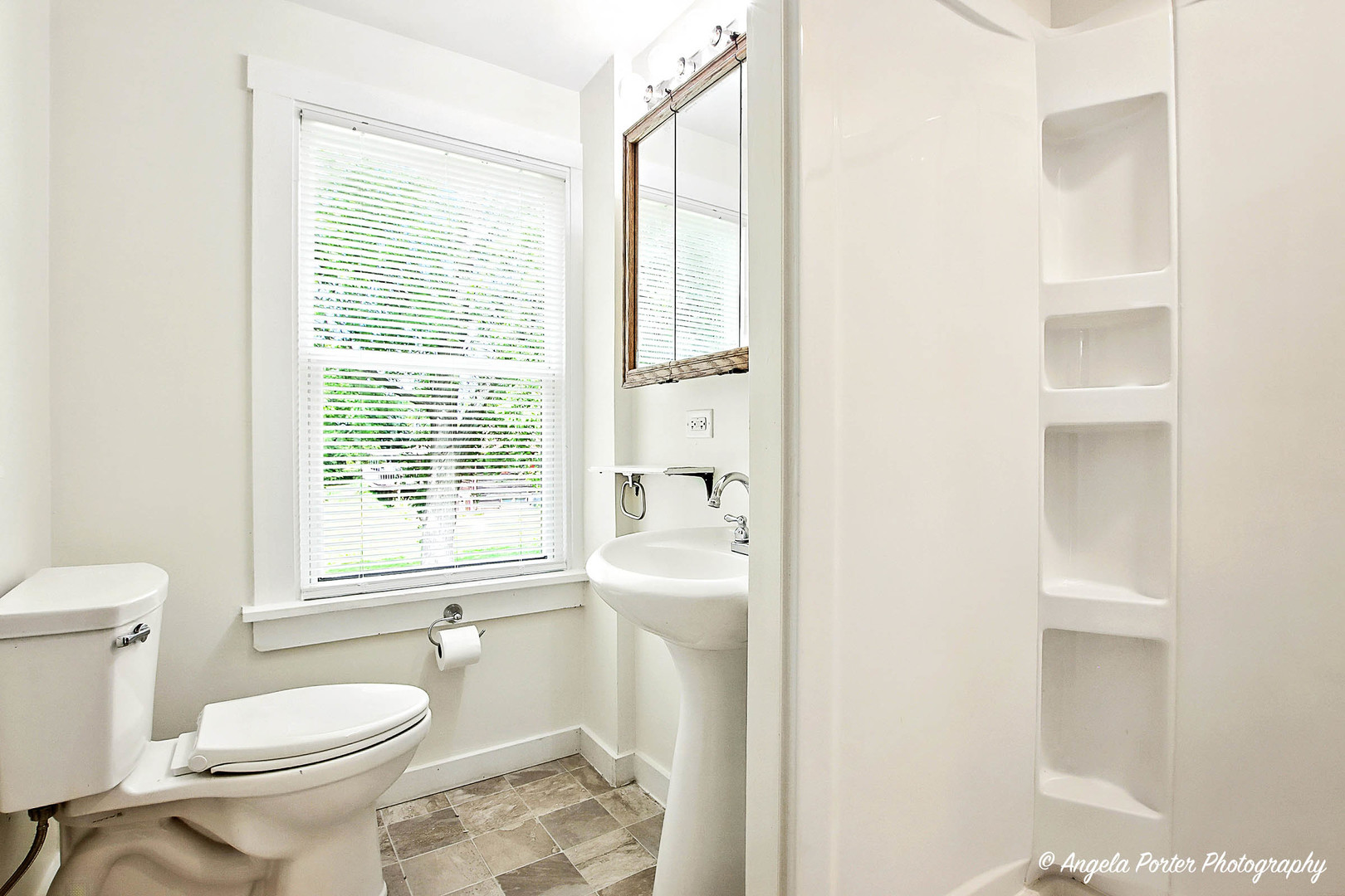 41028 North Ridge Circle Antioch, IL 60002 - Photo 16 of 29 a bathroom with a toilet a sink and a window