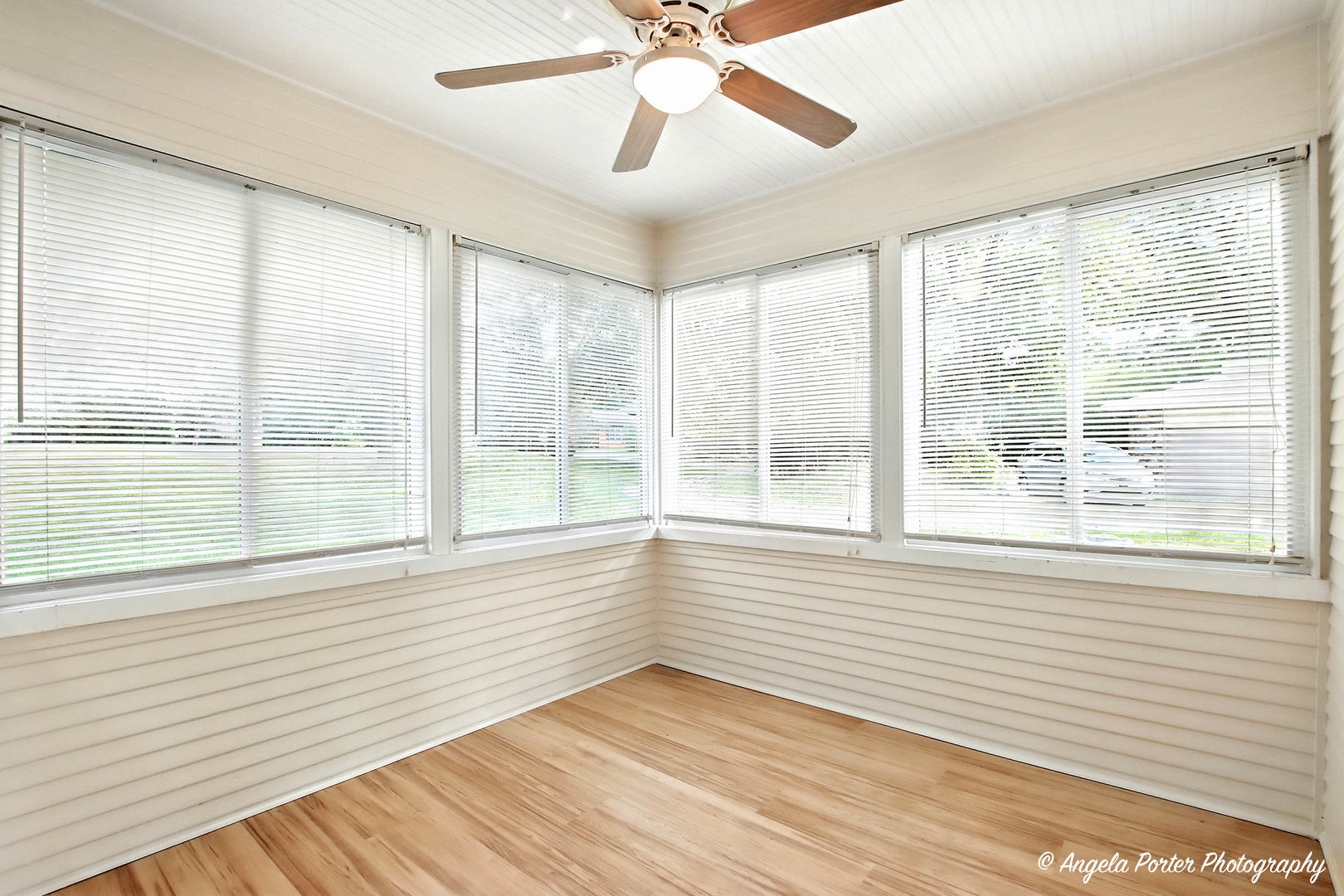 41028 North Ridge Circle Antioch, IL 60002 - Photo 6 of 29 a view of an empty room with a window and wooden floor
