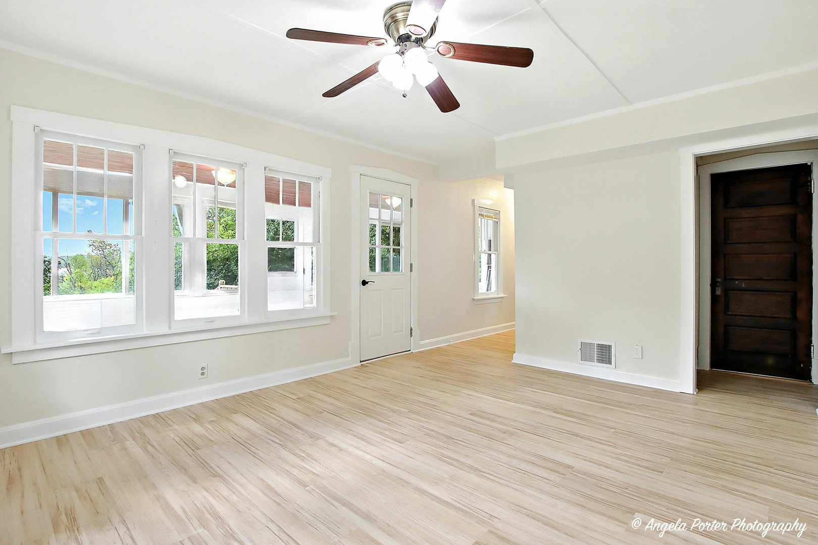 41028 North Ridge Circle Antioch, IL 60002 - Photo 10 of 29 a view of an empty room with a window and wooden floor