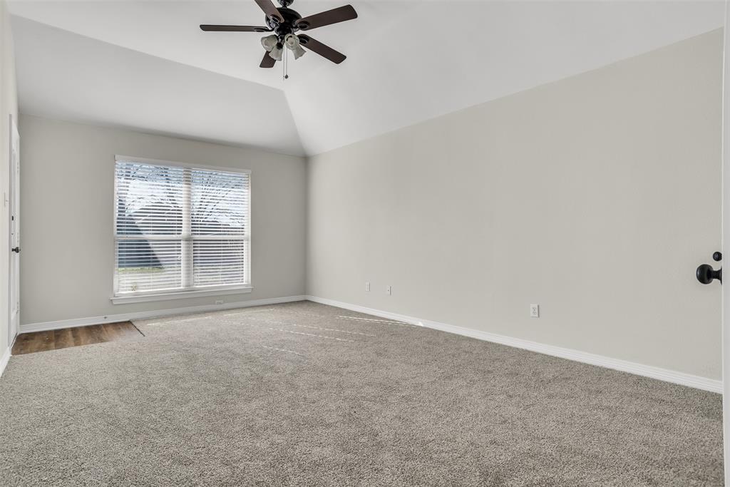 233 Cobblestone Circle Red Oak, TX 75154 - Photo 13 of 23 a view of a livingroom with a ceiling fan and window