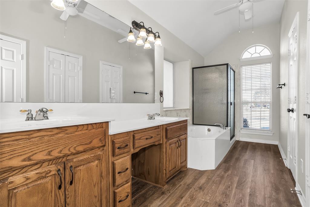 233 Cobblestone Circle Red Oak, TX 75154 - Photo 17 of 23 a spacious bathroom with a tub sink and mirror