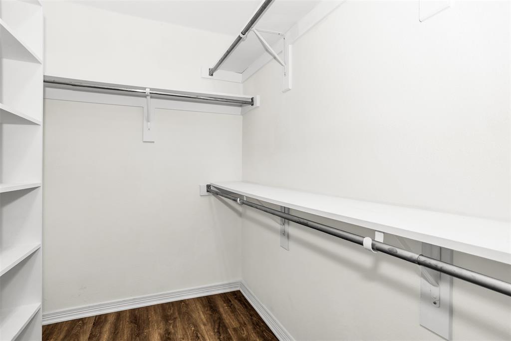233 Cobblestone Circle Red Oak, TX 75154 - Photo 19 of 23 a view of a room with racks on the wall