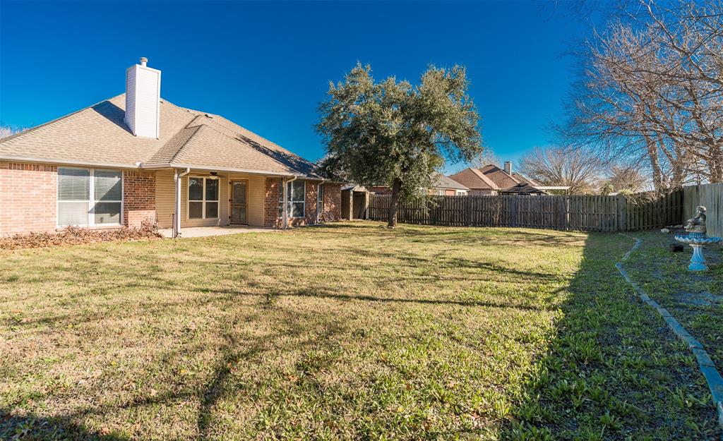 233 Cobblestone Circle Red Oak, TX 75154 - Photo 21 of 23 a front view of a house with a yard