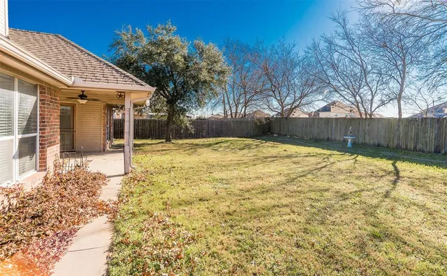 a swimming pool with some trees in the background