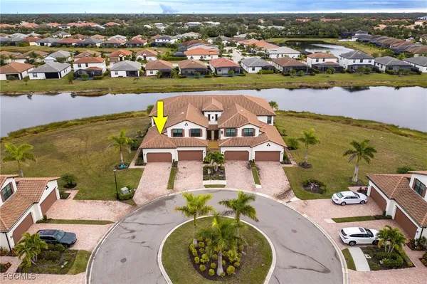 an aerial view of a house with a ocean view
