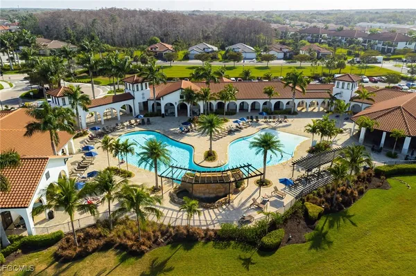 an aerial view of a house with garden space and ocean view