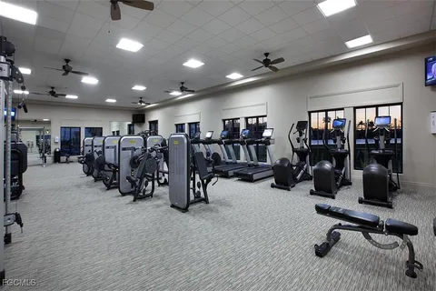 a large room with lots of gym equipment