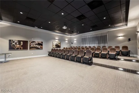 a kitchen with a table chairs and a sink