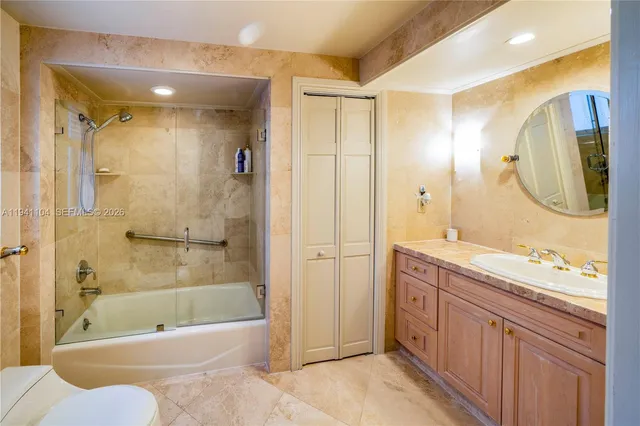 a bedroom with a bed couch and a window