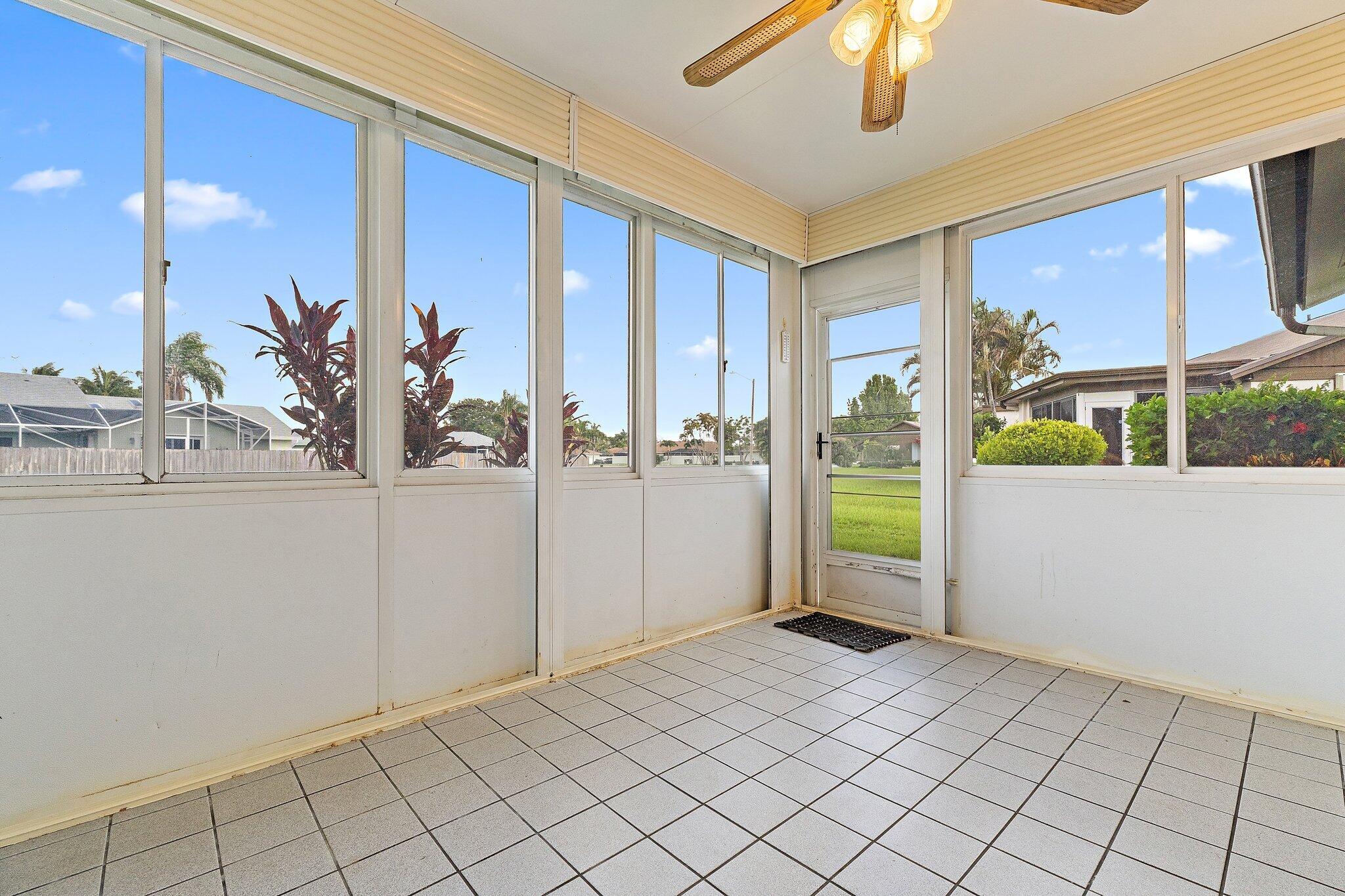 109 Doe Trail Jupiter, FL 33458 - Photo 23 of 26 a view of a livingroom with a furniture and chandelier