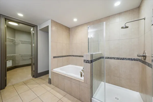 a bathroom with a tub and shower