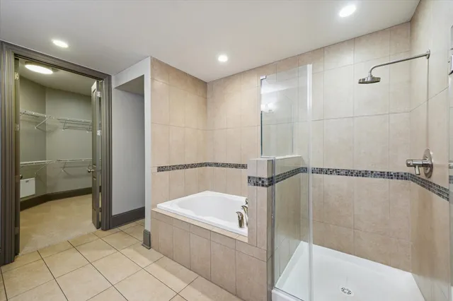 a bathroom with a tub and shower