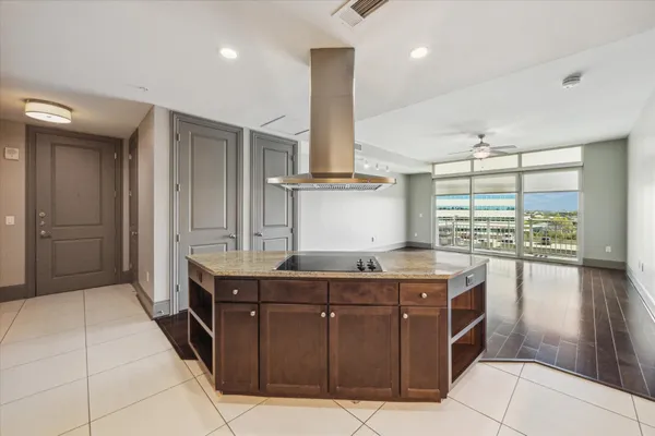 a kitchen with stainless steel appliances granite countertop a sink and a stove