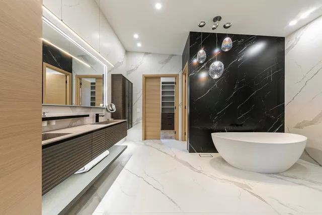 a bathroom with a double vanity sink and a mirror