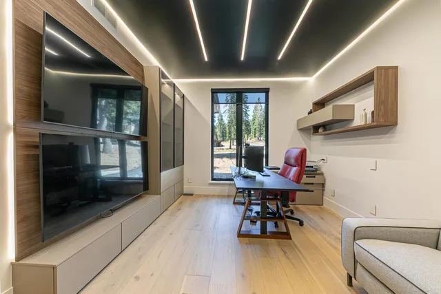 a workspace with furniture hardwood and a window