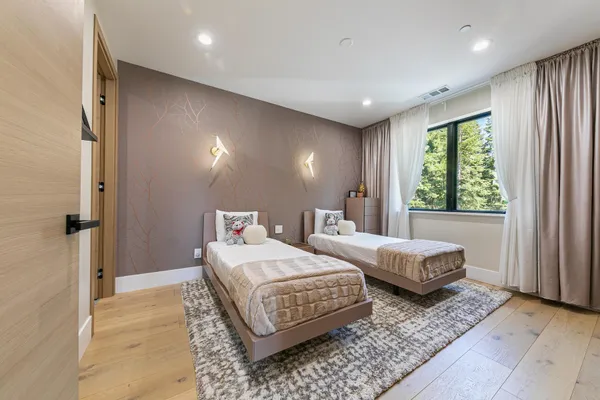 a bedroom with double bed and a window