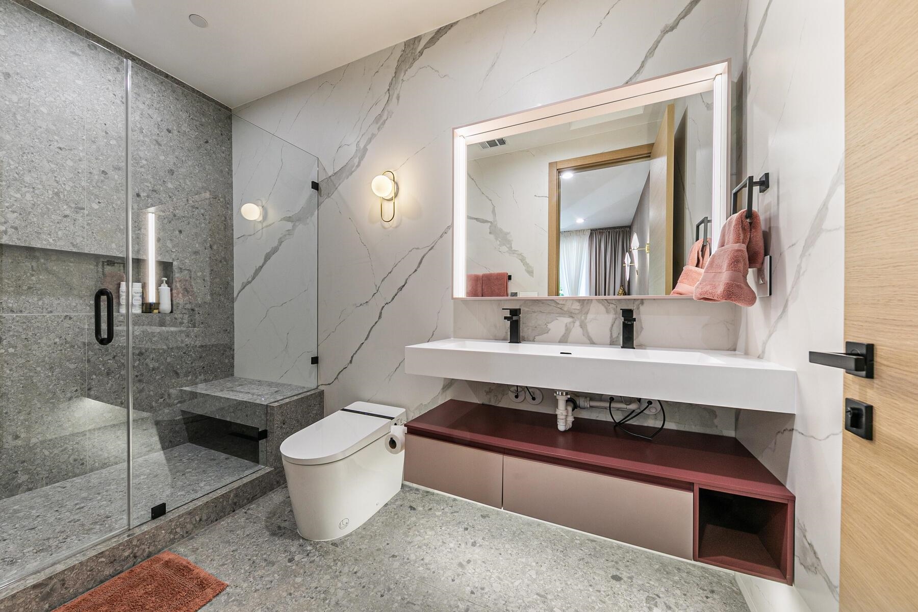 9287 Brae Road Truckee, CA 96161 - Photo 17 of 28 a bathroom with a toilet sink and mirror