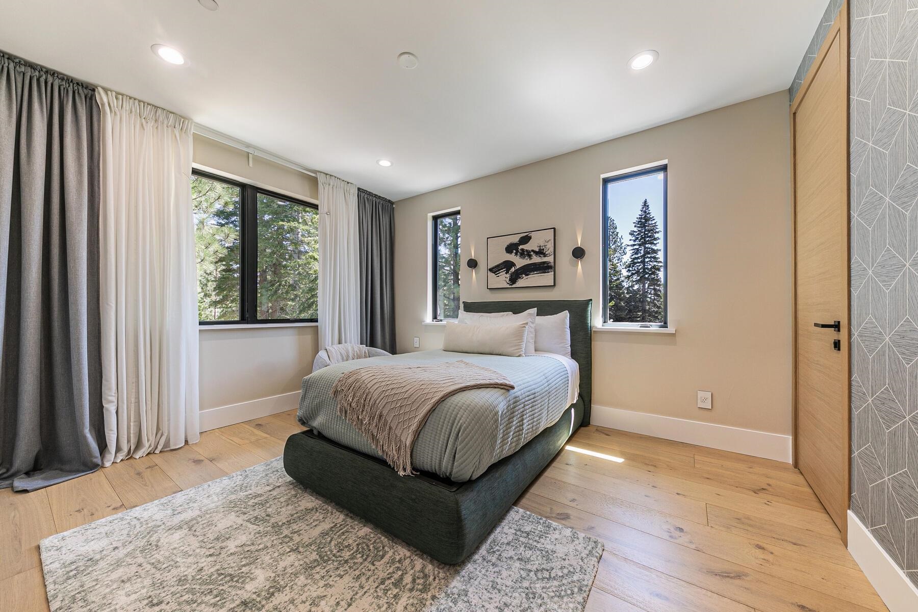 9287 Brae Road Truckee, CA 96161 - Photo 18 of 28 a bedroom with a large bed and a window