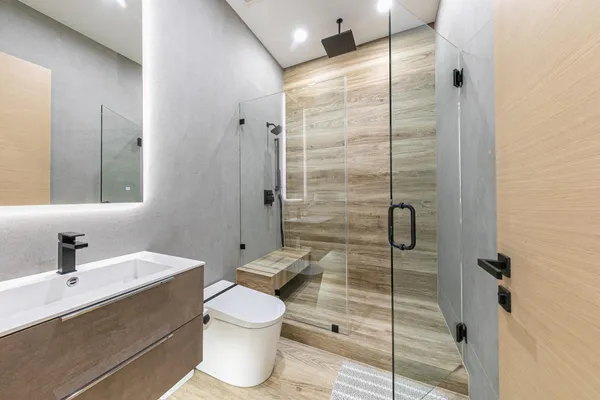 a bathroom with a toilet sink and shower