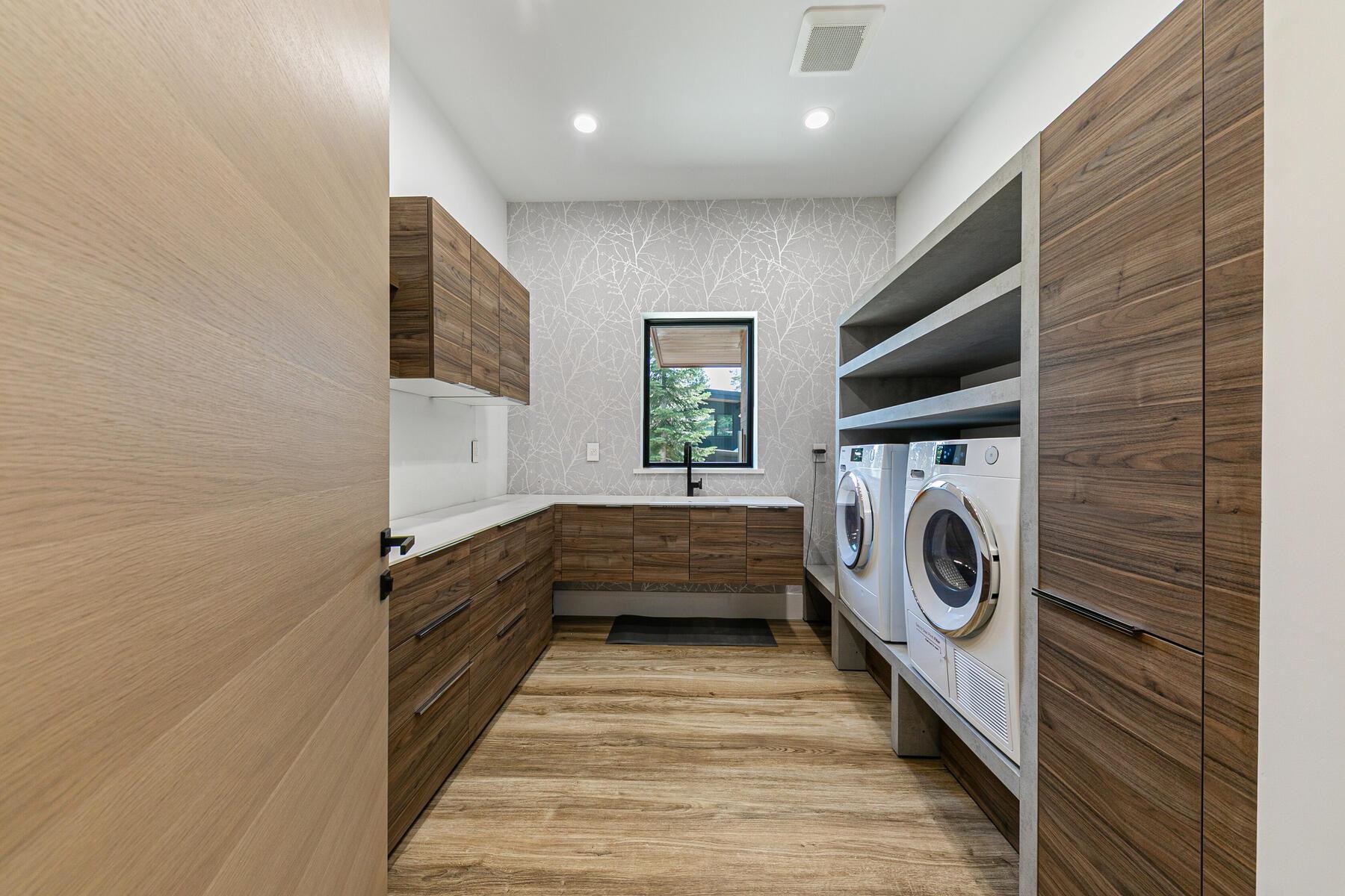 9287 Brae Road Truckee, CA 96161 - Photo 22 of 28 a view of a hallway with washer and dryer