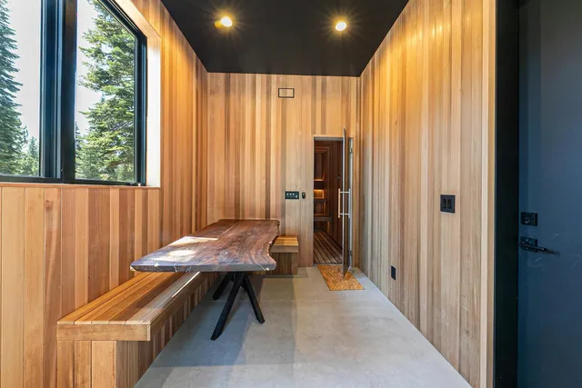 a room with furniture and large windows