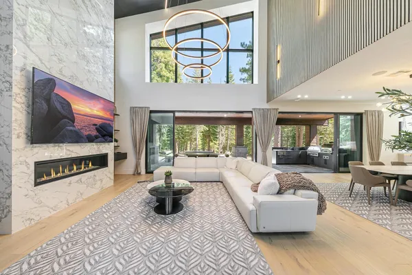 a living room with fireplace furniture and a flat screen tv