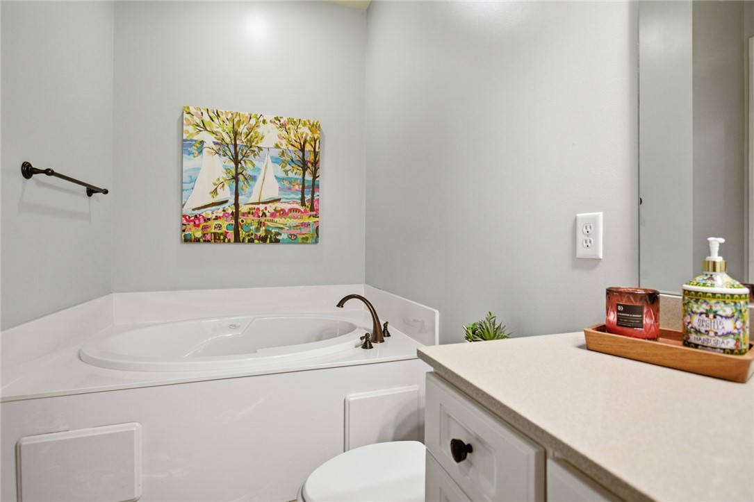 578 Sunset Point Drive West Union, SC 29696 - Photo 12 of 46 This bathroom features a soaking tub, perfect for relaxation, and a vanity with ample counter space.