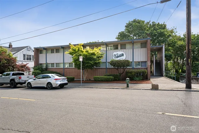 a view of street with parked cars