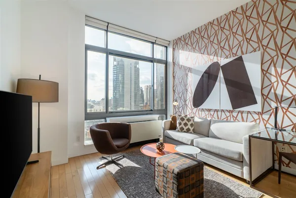 a living room with furniture and a window