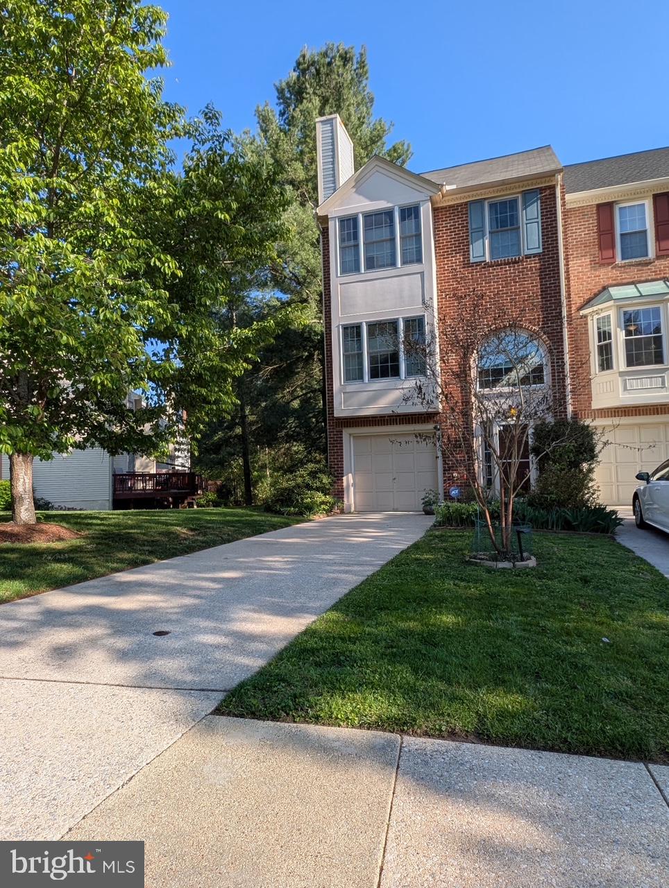 4716 Rams Horn Row Ellicott City, MD 21042 - Photo 1 of 1 a front view of a house with a yard and trees