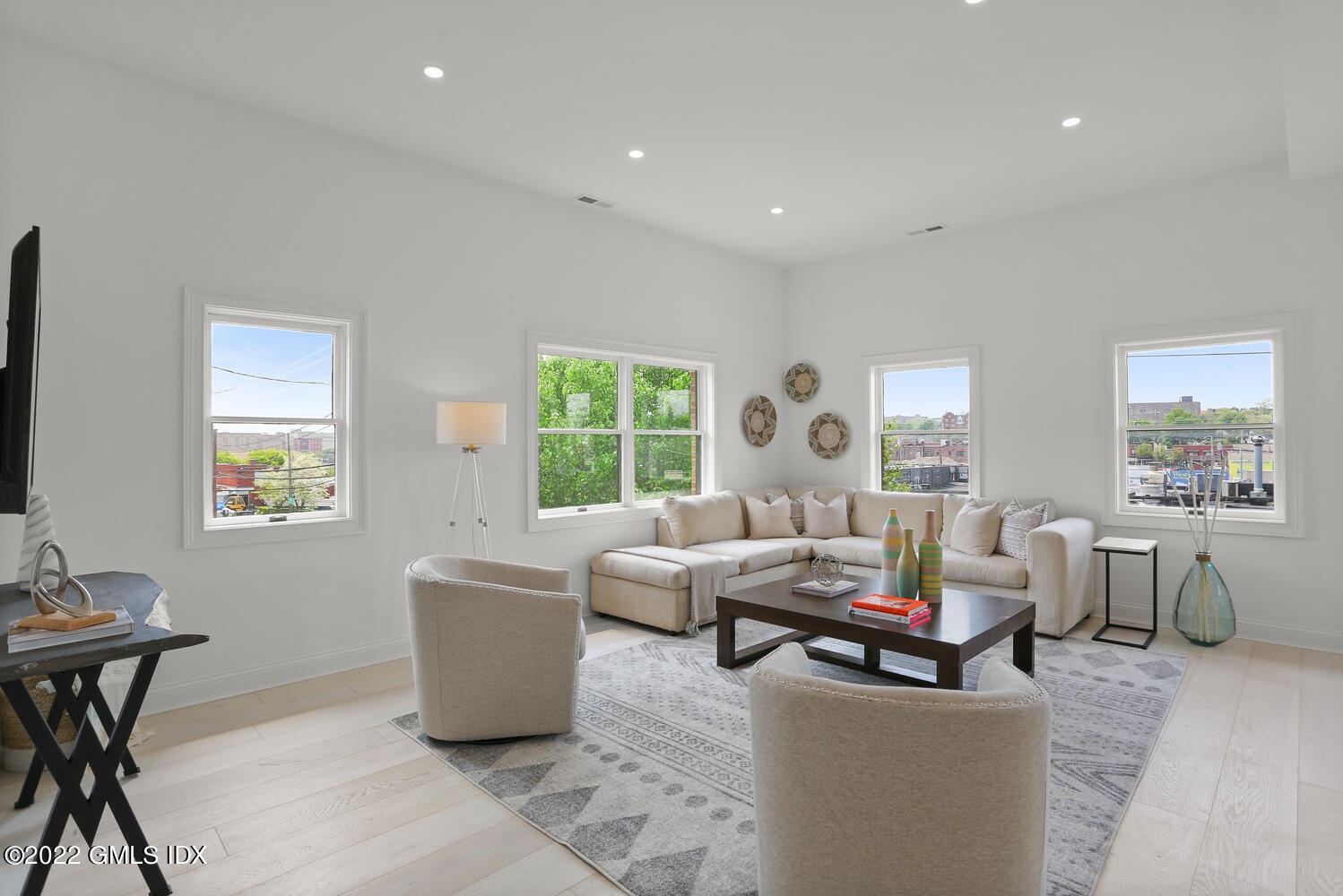 111 Mill Street, Unit PH Greenwich, CT 06830 - Photo 2 of 21 a living room with furniture and a window