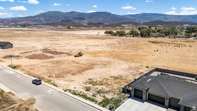 3793 925 North, Unit 13 Cedar City, UT 84721 - Photo 7 of 13 Expansive undeveloped lot featuring a level grade and visible street access