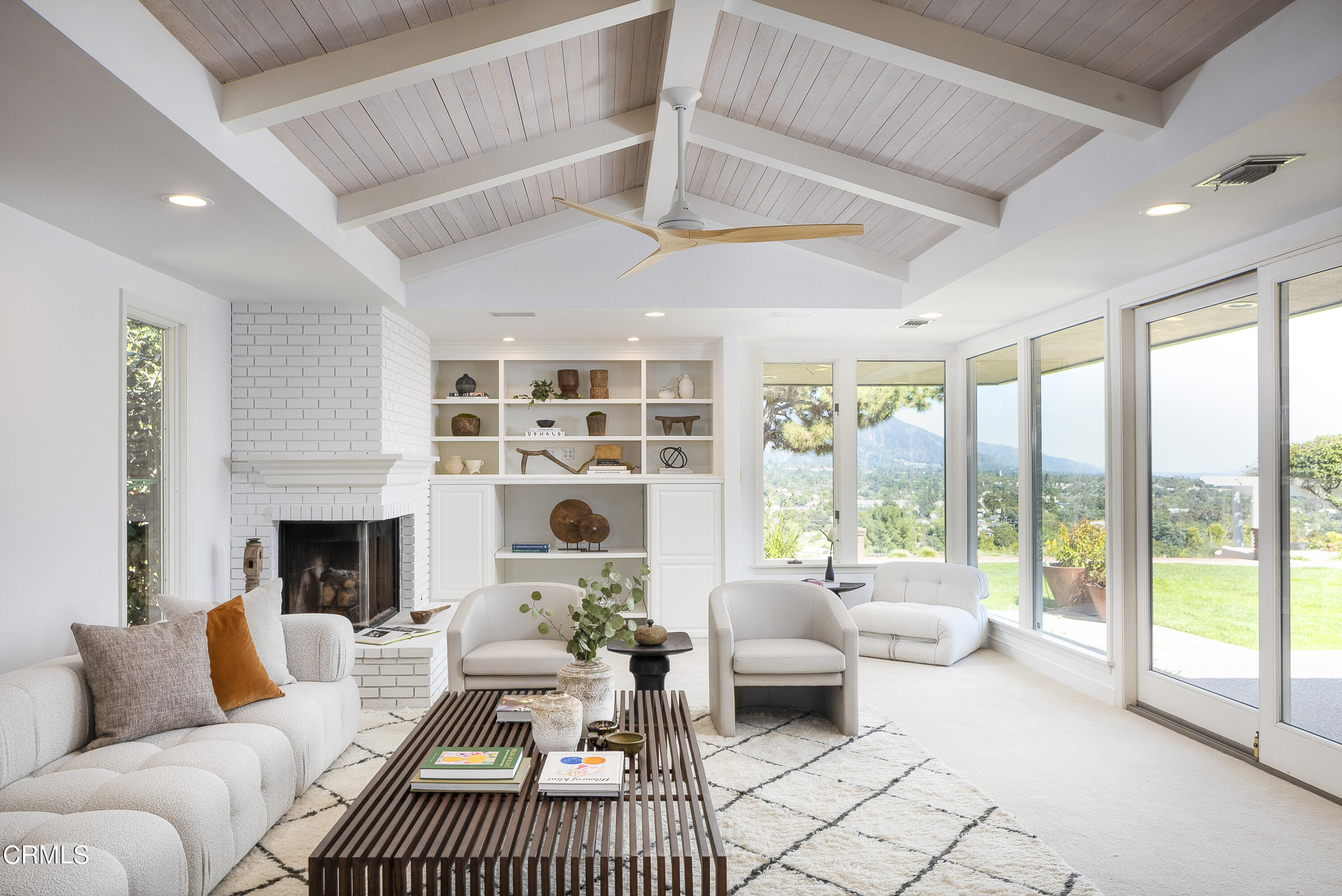 1860 Braemar Road Pasadena, CA 91103 - Photo 3 of 5 a living room with furniture large window and a fireplace