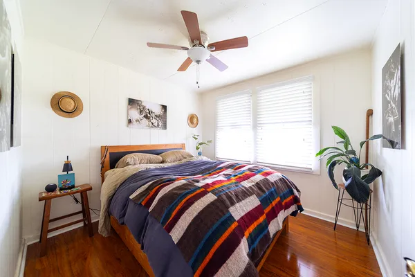 a bedroom with a bed and a window