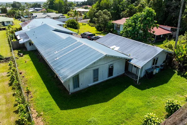 an aerial view of a house with swimming pool