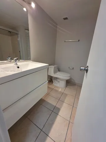 a bathroom with a bathtub and a toilet