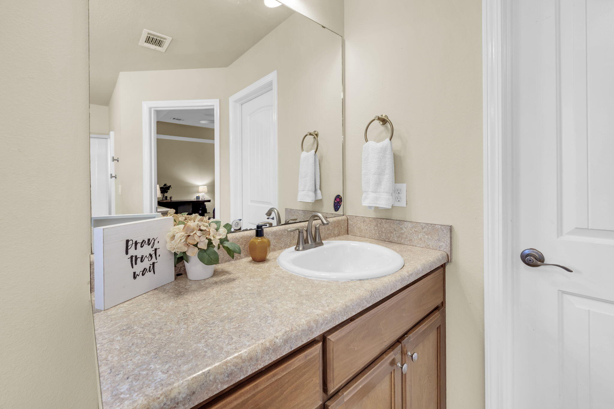 217 Raptor Drive Crestview, FL 32536 - Photo 38 of 48 a bathroom with a granite countertop sink and a mirror