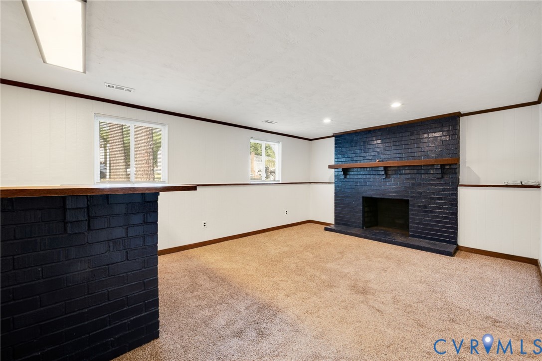 6513 Philbrook Road Richmond, VA 23234 - Photo 12 of 26 The room features a carpeted floor, a prominent da