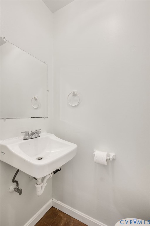 6513 Philbrook Road Richmond, VA 23234 - Photo 16 of 26 Bathroom featuring white walls, a wall-mounted sin