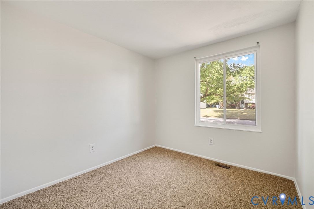 6513 Philbrook Road Richmond, VA 23234 - Photo 17 of 26 Room featuring light-colored walls, carpeted floor