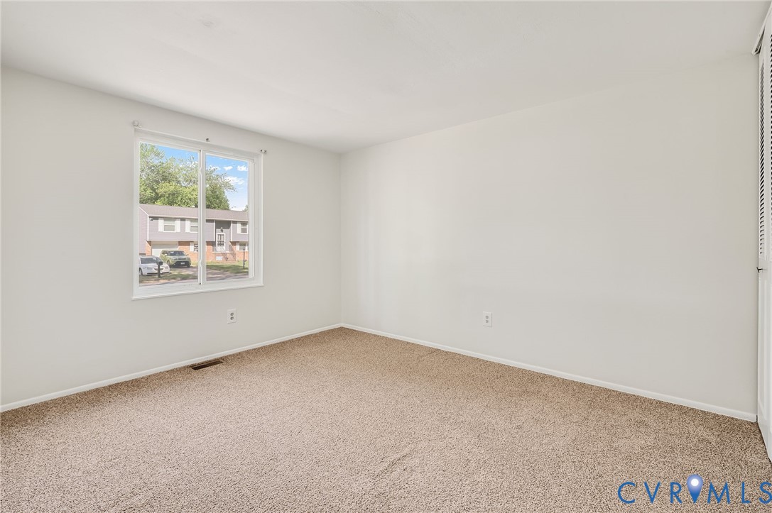6513 Philbrook Road Richmond, VA 23234 - Photo 19 of 26 Room featuring carpet flooring, white walls, and a
